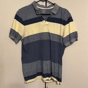 Used banana republic men’s polo, great mix of yellows, light, and dark blues.